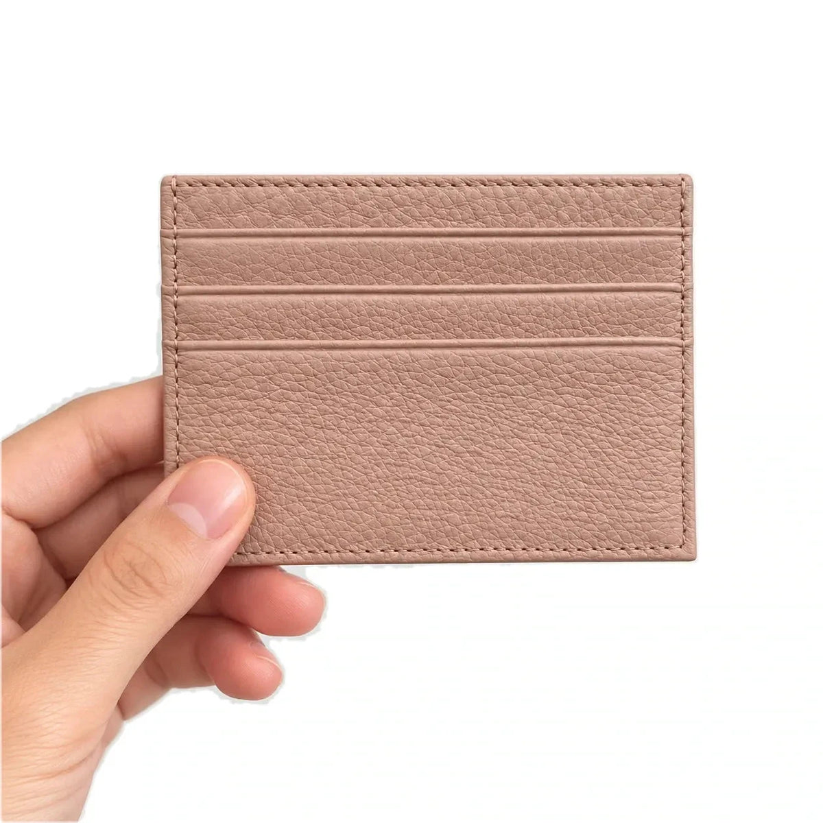 Nouméa — porte-cartes rose poudré tenu en main