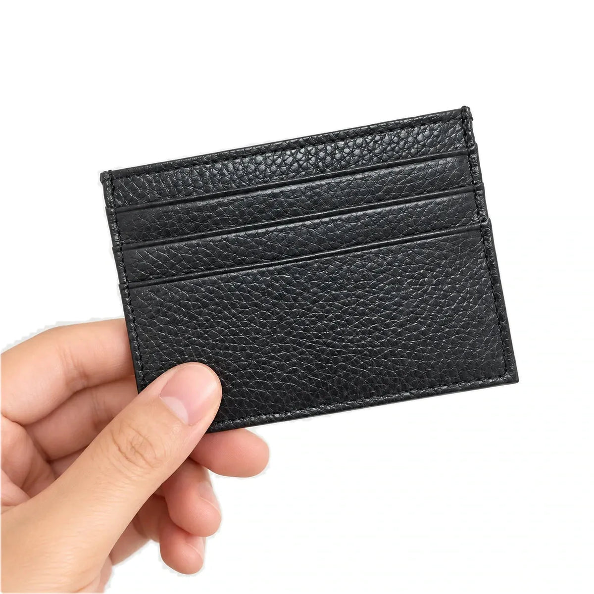 Nouméa — porte-cartes noir tenu en main