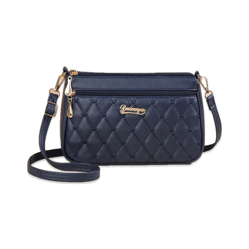 Suresnes - petit sac bandoulière matelassé bleu marine, vue de face sur fond blanc avec ombre douce