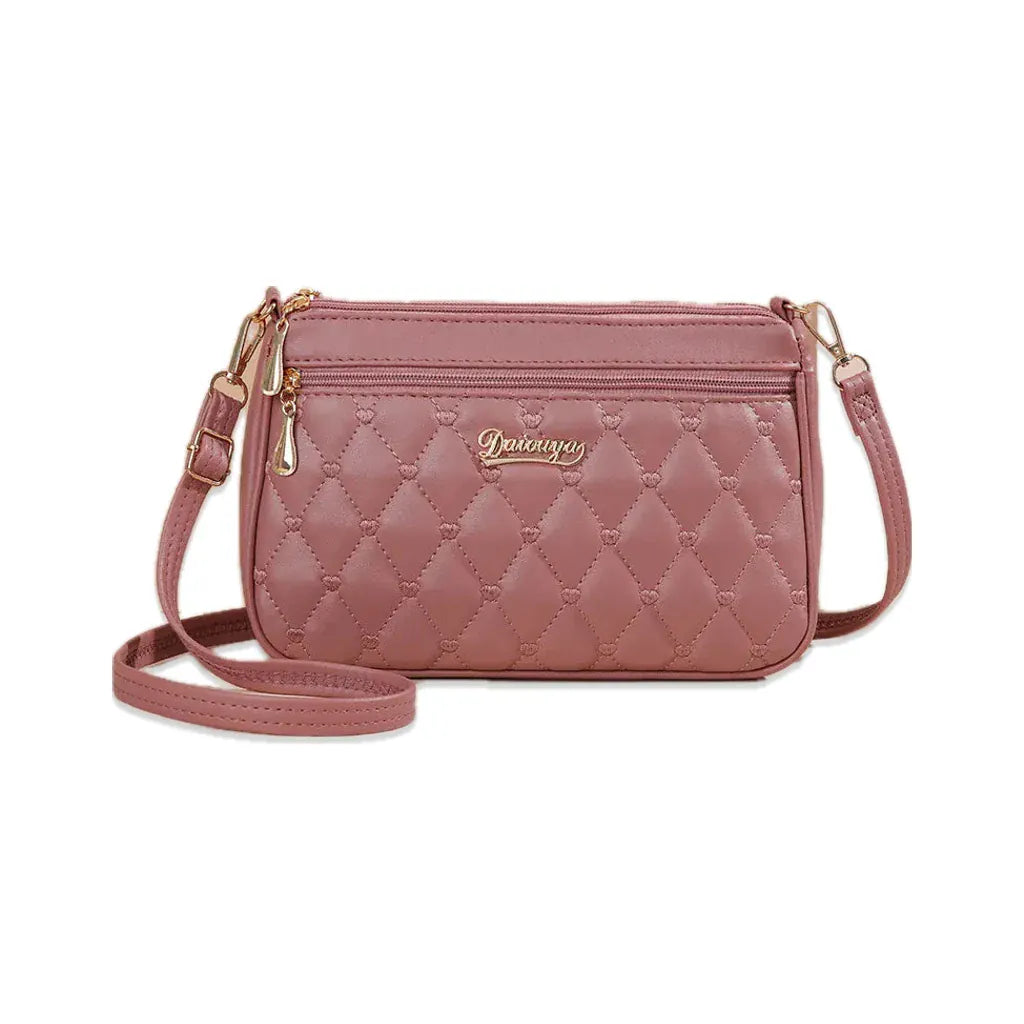 Suresnes - petit sac bandoulière matelassé rose, vue de face sur fond blanc avec ombre douce
